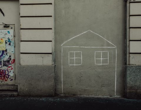 Chalk outline of a house on a wall