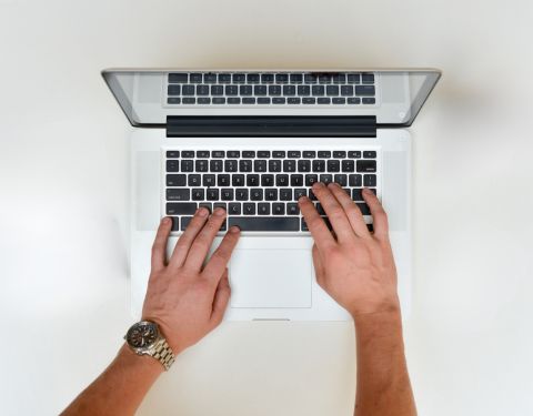 person typing on computer