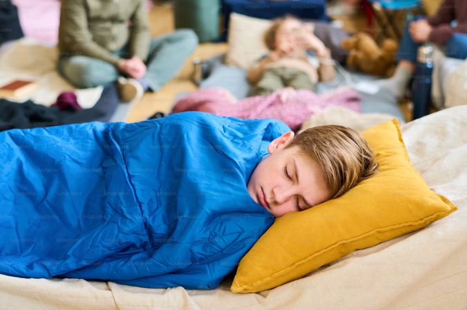 Child sleeping in sleeping bag