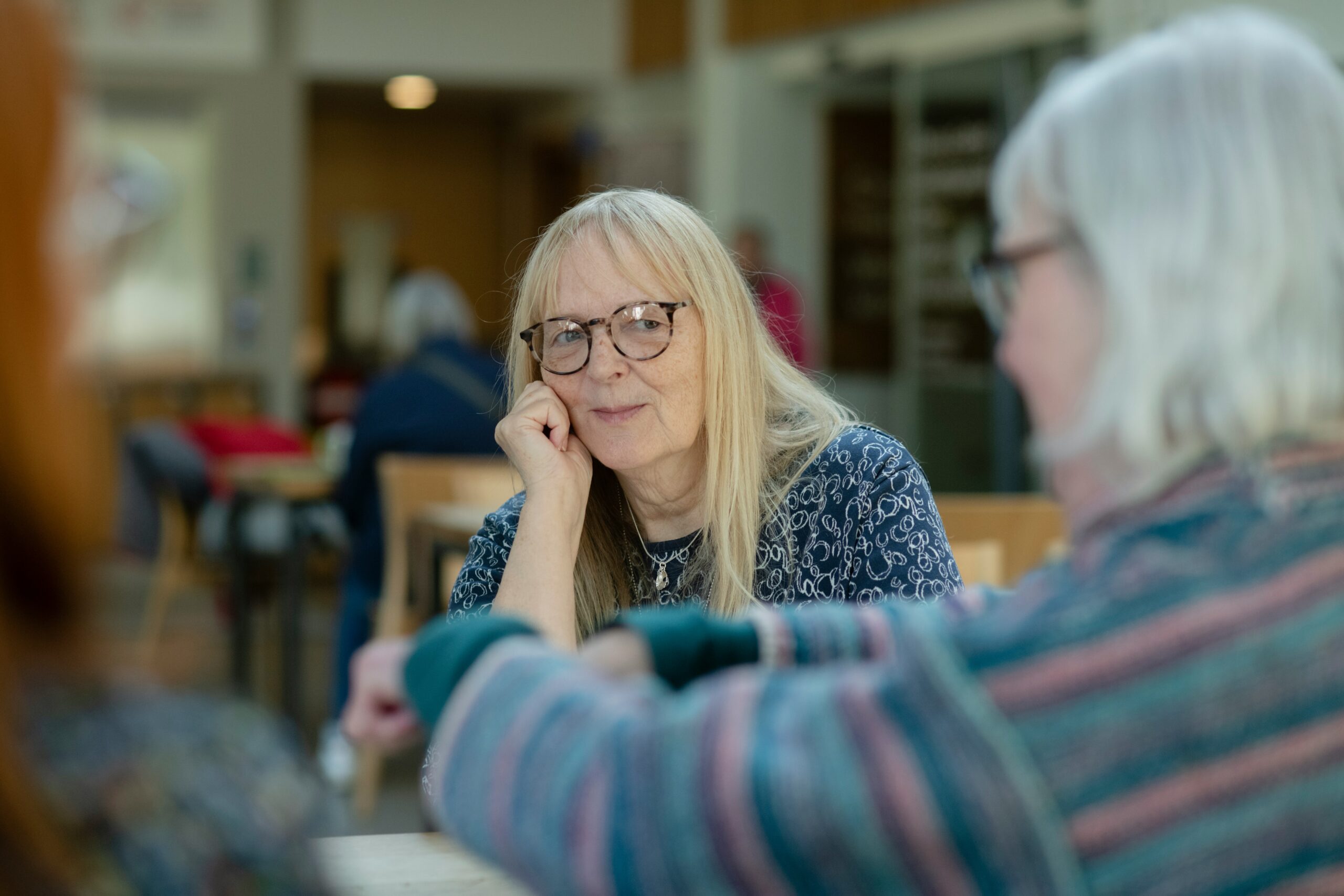 Older lady sitting at a table